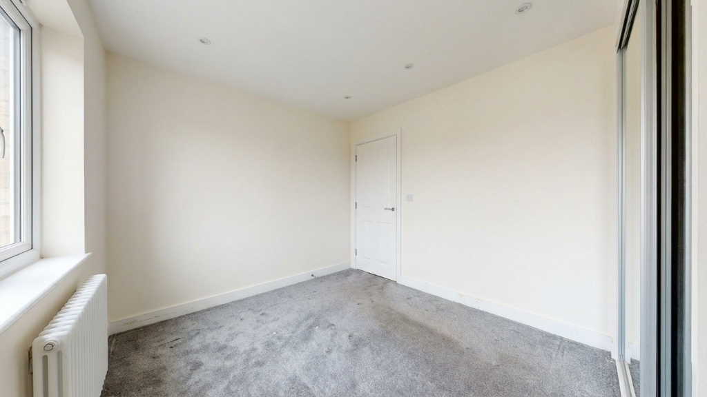 Empty carpeted bedroom